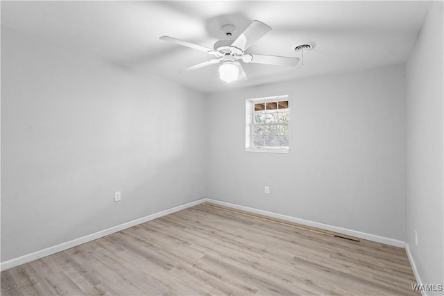 empty room featuring light hardwood / wood-style floors and ceiling fan