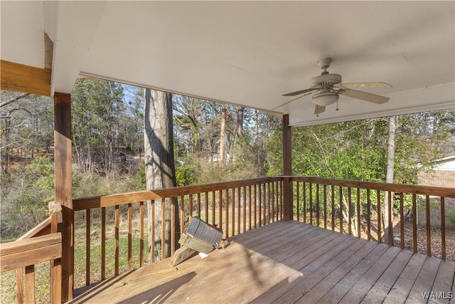 wooden deck featuring ceiling fan