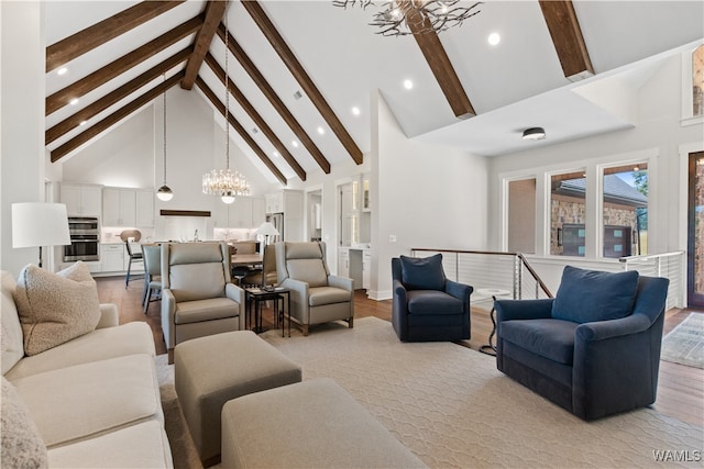 12437 Rising Tide, Northport, AL 35475 - living room with beam ceiling, light hardwood / wood-style flooring, high vaulted ceiling, and a notable chandelier