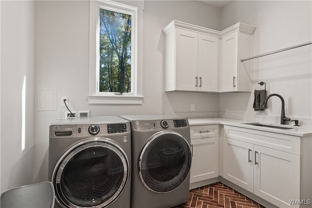 12437 Rising Tide, Northport, AL 35475 - clothes washing area with washer and dryer, cabinets, and sink