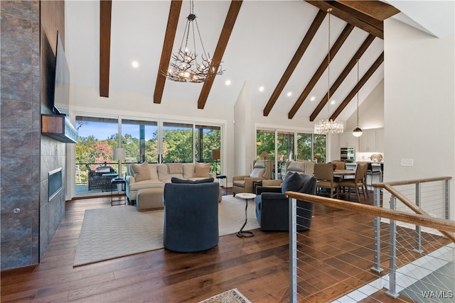 12437 Rising Tide, Northport, AL 35475 - living room featuring beam ceiling, a tile fireplace, an inviting chandelier, dark hardwood / wood-style flooring, and high vaulted ceiling
