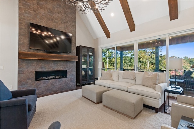 12437 Rising Tide, Northport, AL 35475 - carpeted living room with a fireplace, beamed ceiling, a notable chandelier, and high vaulted ceiling