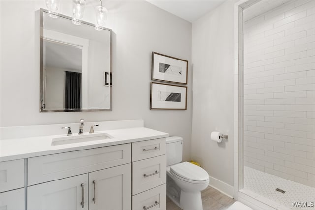 12437 Rising Tide, Northport, AL 35475 - bathroom with tiled shower, vanity, and toilet