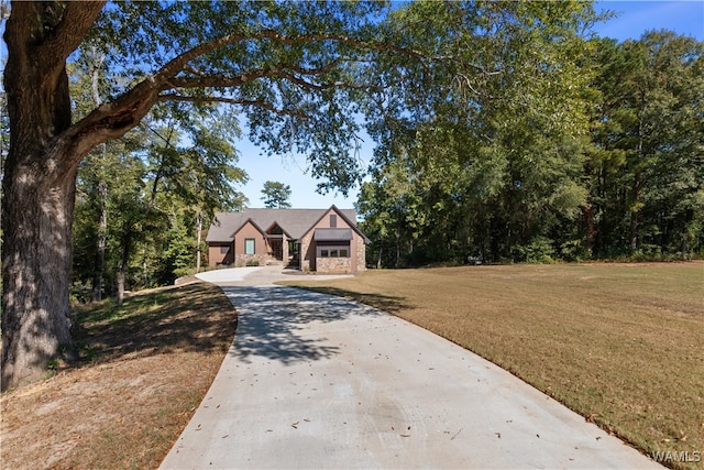 12437 Rising Tide, Northport, AL 35475 - tudor-style house with a front yard