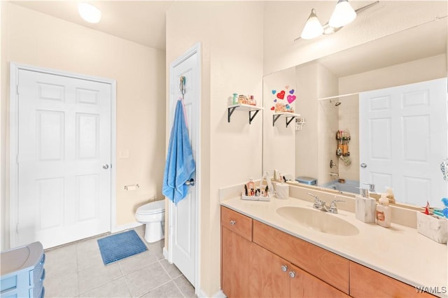 full bath featuring toilet, vanity, tub / shower combination, and tile patterned floors