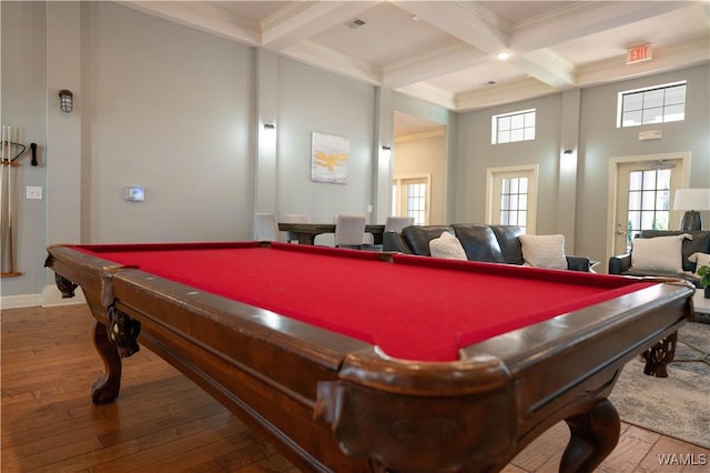 game room with pool table, coffered ceiling, wood finished floors, ornamental molding, and beamed ceiling