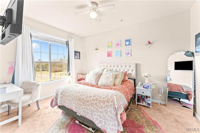 bedroom with baseboards, ceiling fan, and light colored carpet