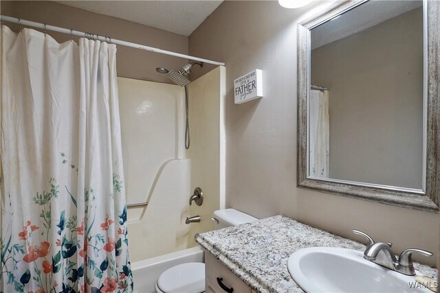 bathroom featuring toilet, shower / tub combo, and vanity