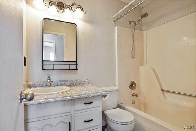 full bathroom with toilet,  shower combination, and vanity