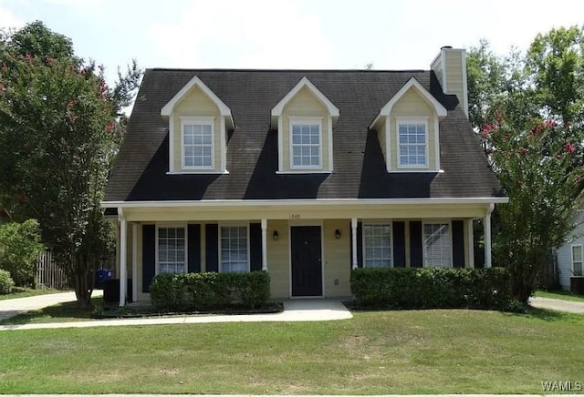 cape cod-style house with a porch and a front lawn