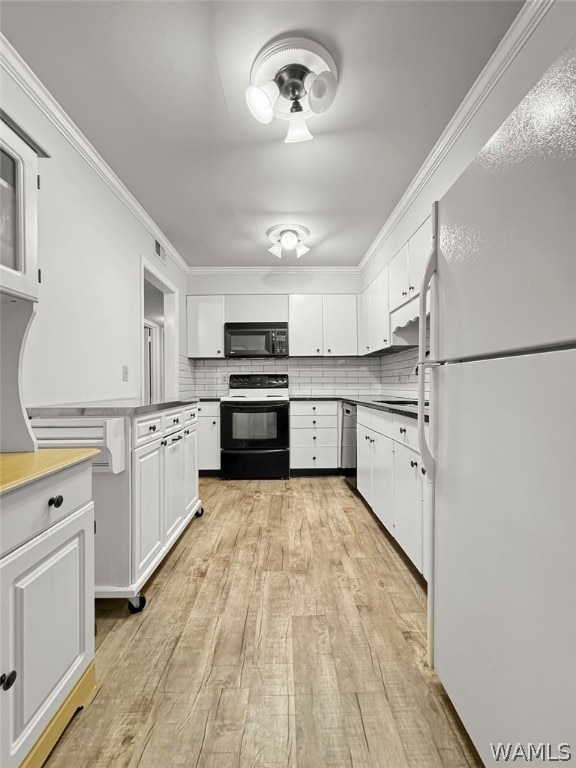 kitchen with white cabinetry, black appliances, ornamental molding, and tasteful backsplash