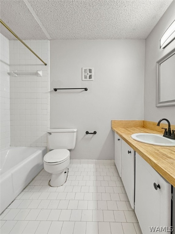 full bathroom featuring toilet, vanity, tiled shower / bath combo, and tile patterned floors