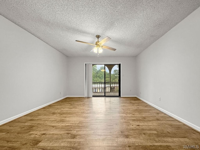 unfurnished room featuring a textured ceiling, ceiling fan, and light hardwood / wood-style floors