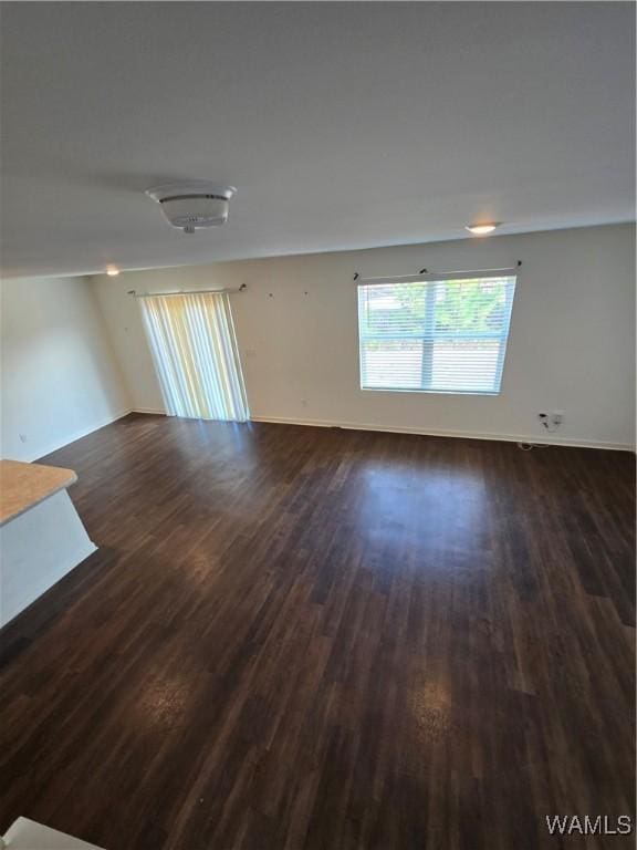 unfurnished room featuring dark hardwood / wood-style floors