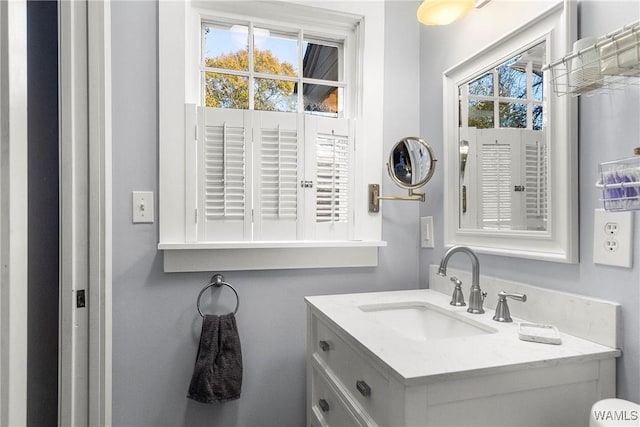 bathroom featuring vanity and a healthy amount of sunlight