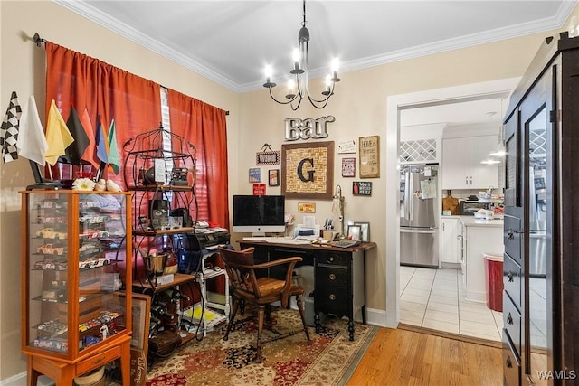 office area featuring an inviting chandelier, light hardwood / wood-style floors, and ornamental molding