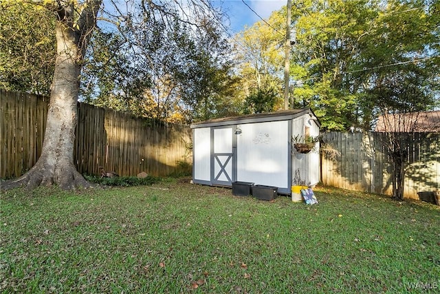 view of outbuilding with a yard