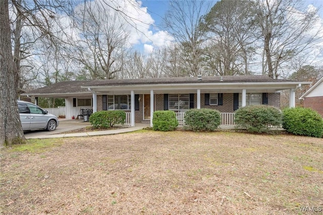 single story home with a front lawn and a porch