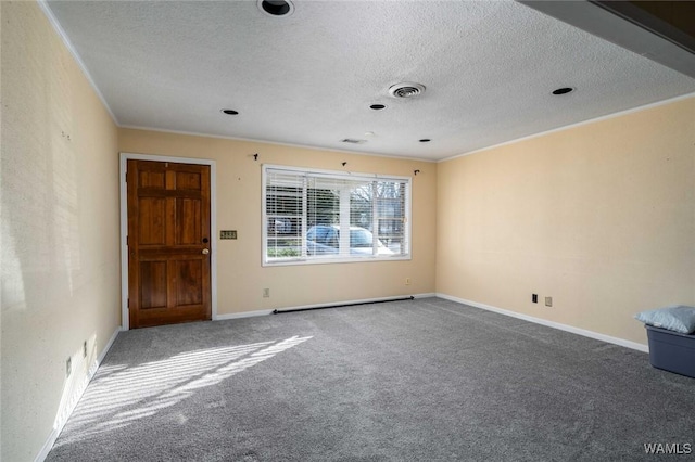 carpeted spare room with crown molding and a textured ceiling