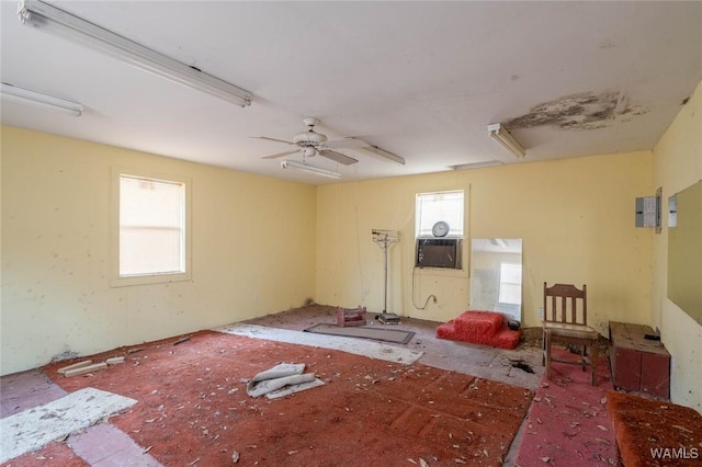 empty room with a wealth of natural light and ceiling fan