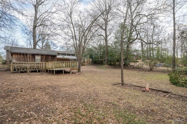 view of yard featuring a wooden deck