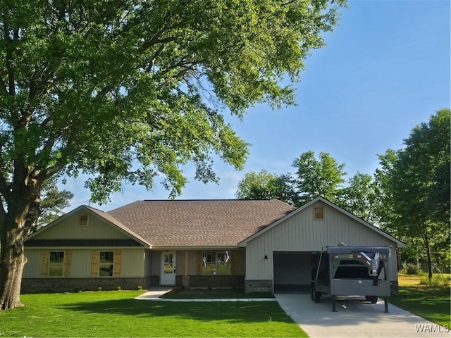 ranch-style home with a front yard, an attached garage, concrete driveway, brick siding, and roof with shingles