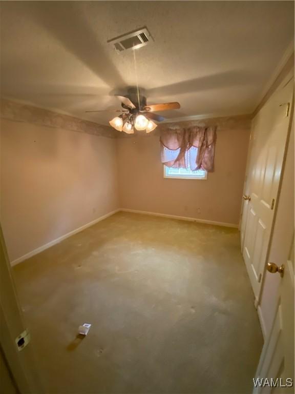 924 12th St SW, Fayette, AL 35555 - unfurnished bedroom featuring baseboards and a ceiling fan