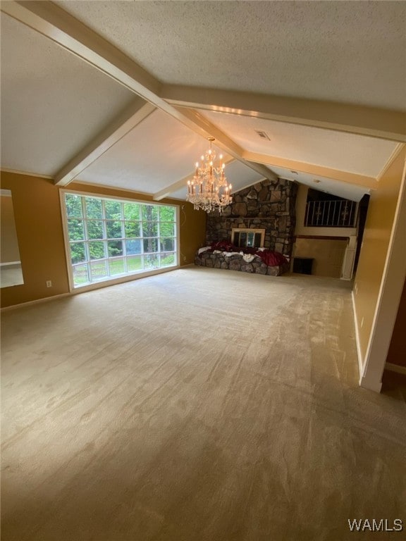 924 12th St SW, Fayette, AL 35555 - unfurnished living room featuring a chandelier, carpet floors, a stone fireplace, a textured ceiling, and baseboards