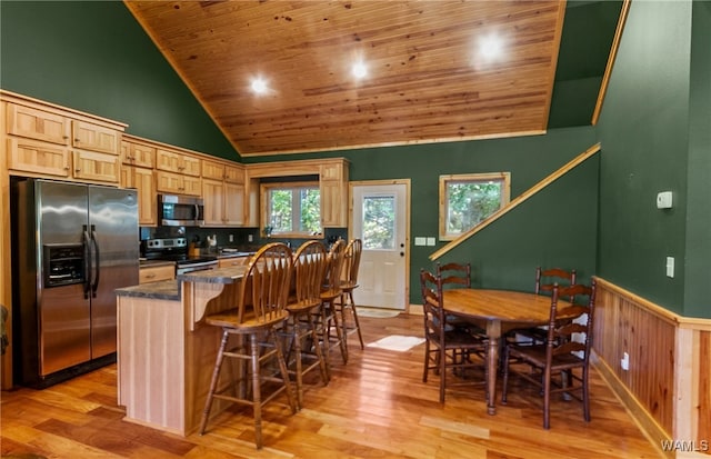 kitchen featuring light brown cabinets, wooden ceiling, appliances with stainless steel finishes, and light hardwood / wood-style flooring