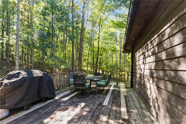 wooden terrace featuring area for grilling