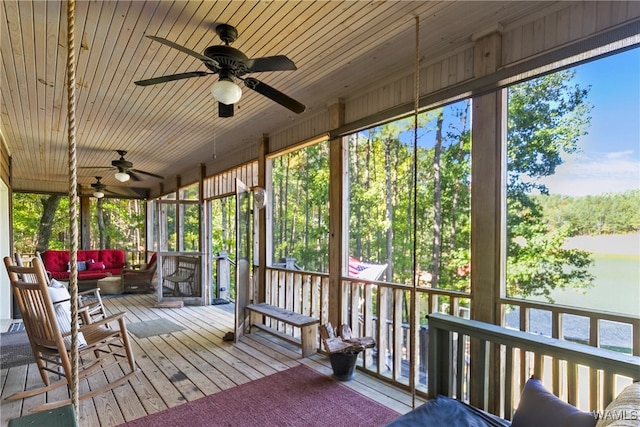 unfurnished sunroom with ceiling fan and a healthy amount of sunlight