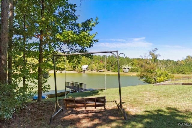 view of community featuring a yard and a water view