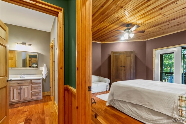 bedroom with access to exterior, wood ceiling, ceiling fan, sink, and light hardwood / wood-style floors