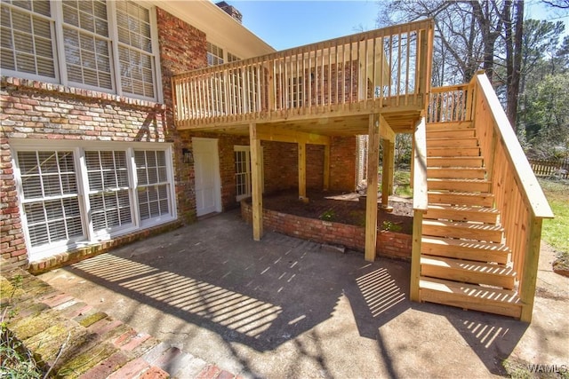 view of patio / terrace featuring a deck and stairway