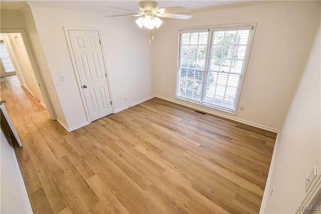 unfurnished bedroom with baseboards, visible vents, and light wood-type flooring