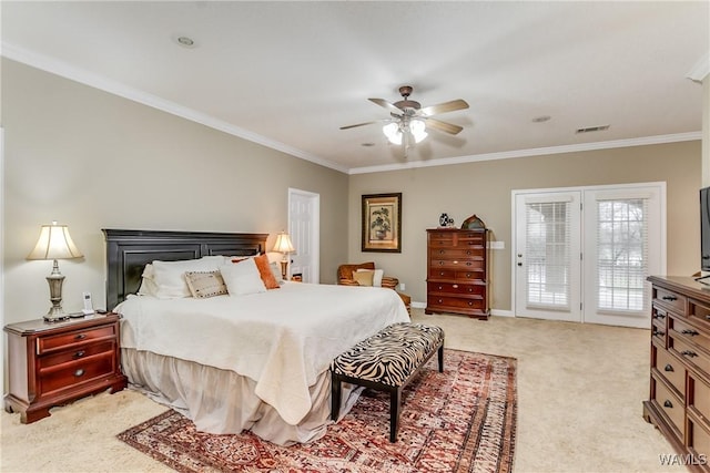 bedroom with access to exterior, visible vents, crown molding, and light carpet