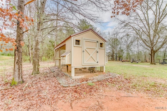 view of poultry coop with a yard