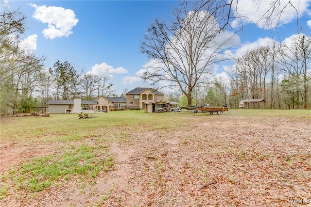 view of yard with a fire pit