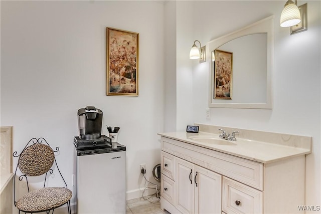 bathroom featuring vanity and baseboards