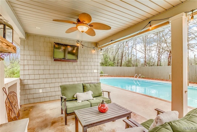 view of swimming pool featuring a patio area, a fenced backyard, an outdoor living space, and a fenced in pool