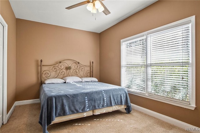 carpeted bedroom featuring ceiling fan