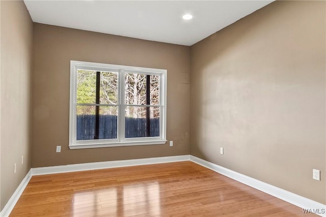 spare room with light hardwood / wood-style floors