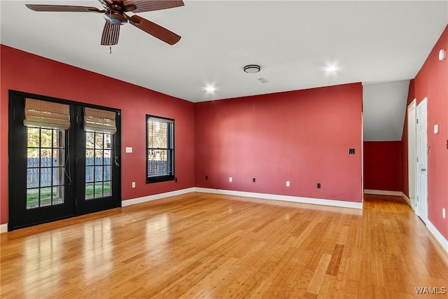 empty room featuring ceiling fan and light hardwood / wood-style floors