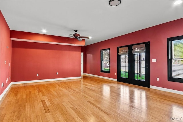 unfurnished room with ceiling fan and wood-type flooring