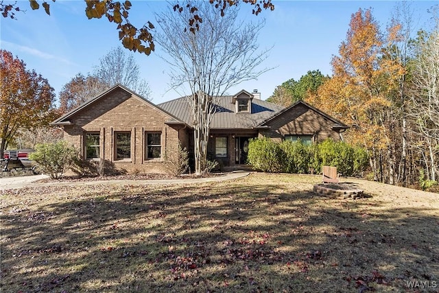 view of front of house featuring an outdoor fire pit