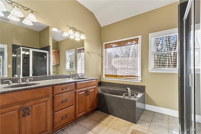 bathroom with shower with separate bathtub, a healthy amount of sunlight, tile patterned flooring, and lofted ceiling