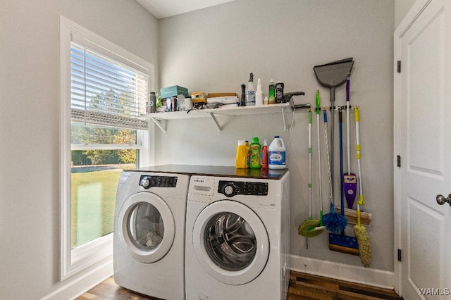 laundry room with wood-type flooring and washing machine and clothes dryer