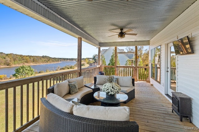 deck featuring outdoor lounge area and ceiling fan