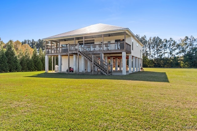 back of house with a lawn