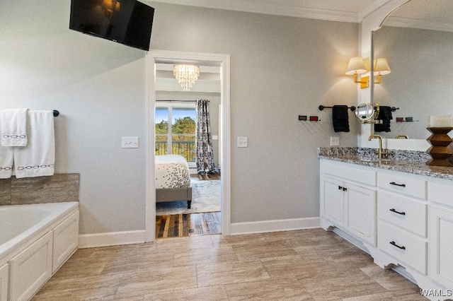 bathroom featuring a bath, crown molding, and vanity